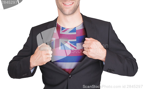 Image of Businessman opening suit to reveal shirt with state flag