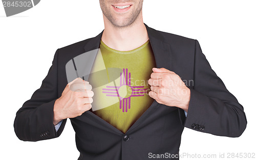 Image of Businessman opening suit to reveal shirt with state flag