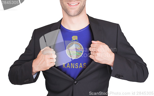 Image of Businessman opening suit to reveal shirt with state flag