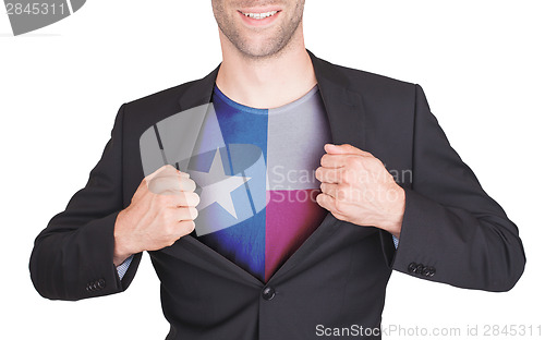 Image of Businessman opening suit to reveal shirt with state flag