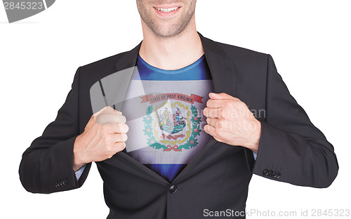 Image of Businessman opening suit to reveal shirt with state flag