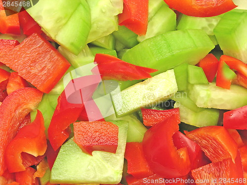 Image of Slices of cucumber and red pepper in a close-up view