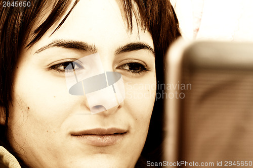 Image of Young woman with laptop 