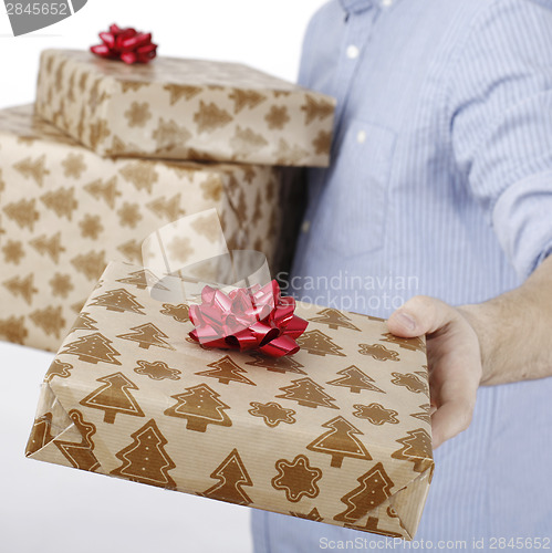 Image of Young man holding a present