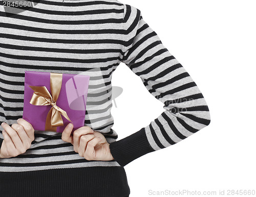 Image of Young woman holding a present