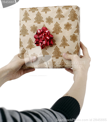 Image of Young woman holding a present