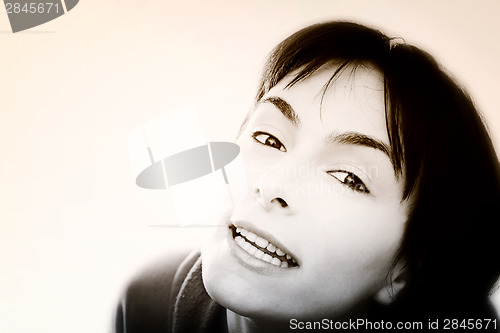 Image of Young woman in bed