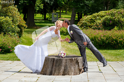 Image of beautiful young wedding couple kissing