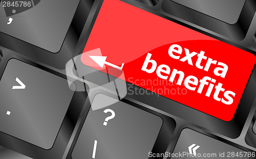 Image of extra benefits button on keyboard - business concept