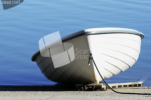 Image of white shallop on a background of water