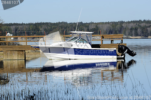 Image of big white boat tied up at the seashore