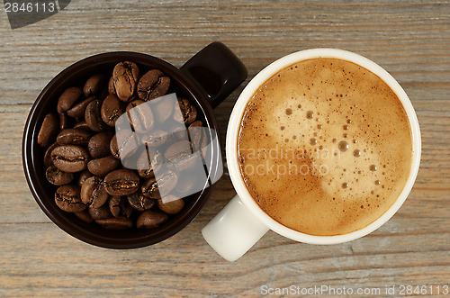 Image of two cups of coffee and beans