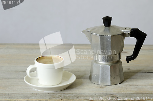 Image of cup of coffee and percolator