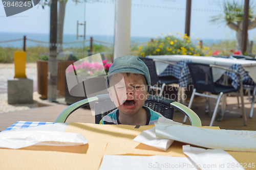 Image of Unhappy crying baby boy