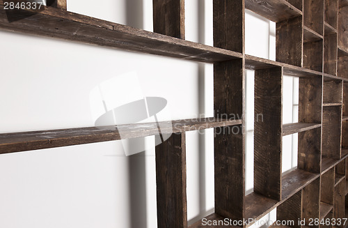 Image of Rustic style shelves on white wall