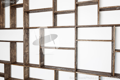 Image of Rustic style shelves on white wall