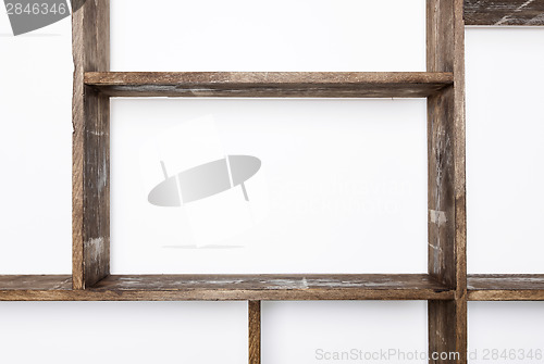 Image of Rustic style shelves on white wall