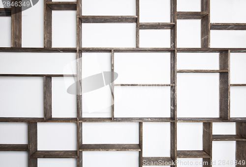 Image of Rustic style shelves on white wall