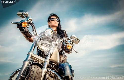 Image of Biker girl on a motorcycle