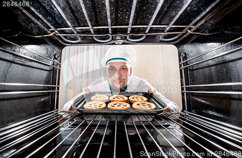 Image of Chef cooking in the oven.