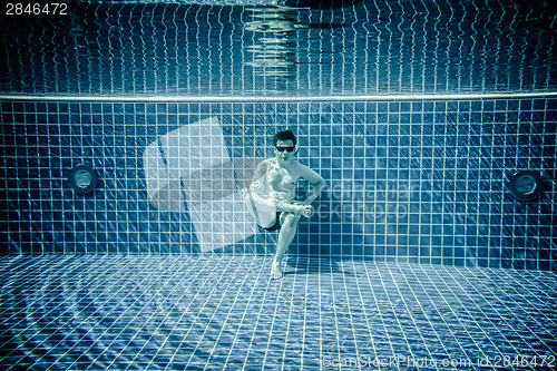 Image of Persons lies under water in a swimming pool