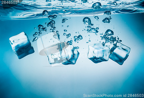 Image of Ice cubes falling under water