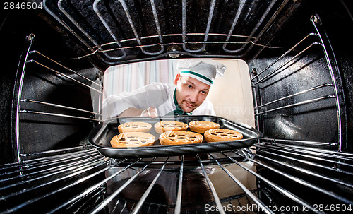 Image of Chef cooking in the oven.