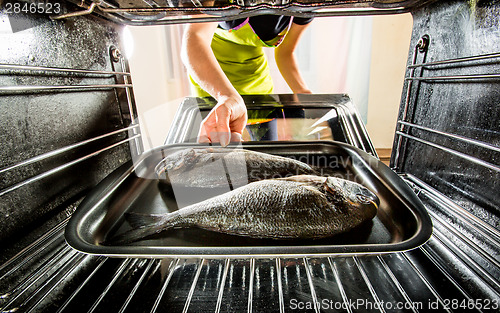 Image of Cooking Dorado fish in the oven.