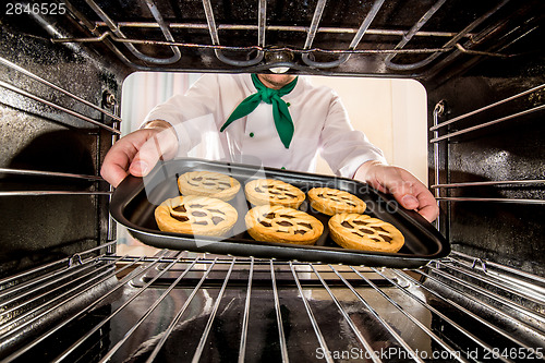 Image of Chef cooking in the oven.