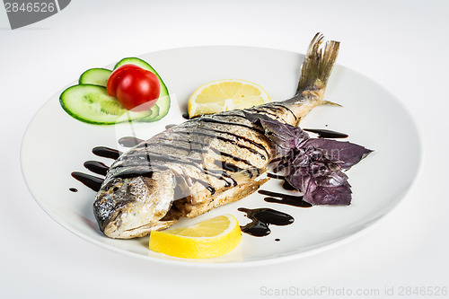 Image of Dorado roast fish on the white