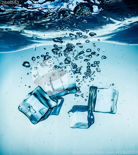 Image of Ice cubes falling under water