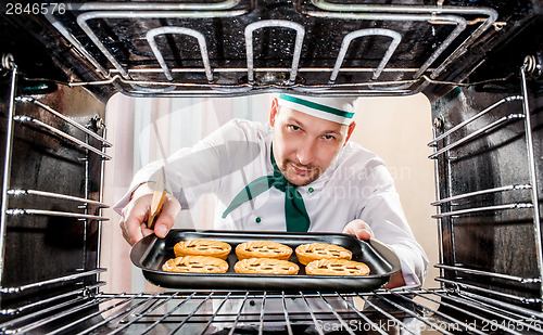 Image of Chef cooking in the oven.