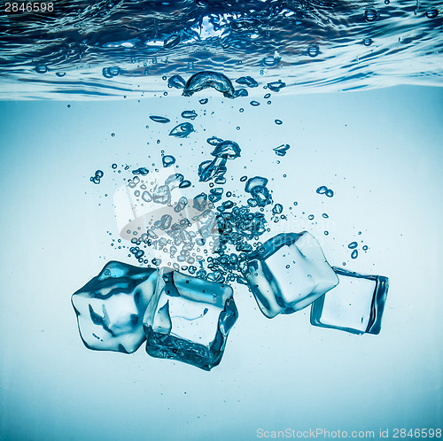 Image of Ice cubes falling under water