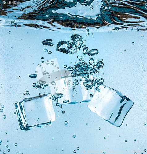 Image of Ice cubes falling under water