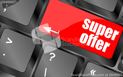 Image of Super offer text on laptop computer keyboard