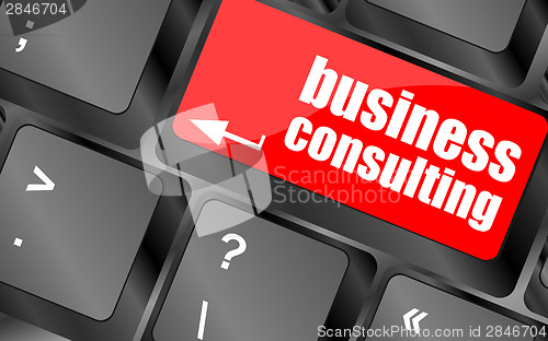 Image of Computer keyboard with business consulting key. business concept