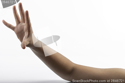 Image of Young hands makes rock-paper-scissors