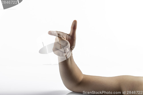 Image of Young hands makes gun sign