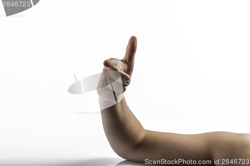 Image of Young hands makes gun sign