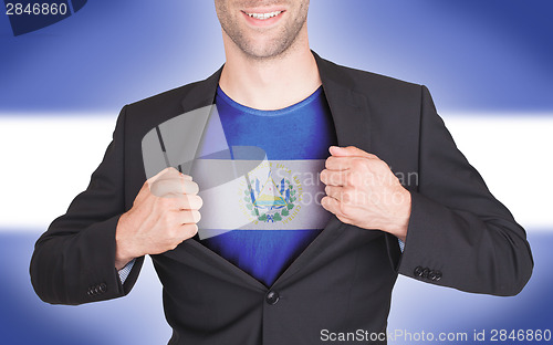 Image of Businessman opening suit to reveal shirt with flag