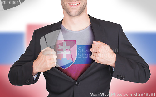 Image of Businessman opening suit to reveal shirt with flag