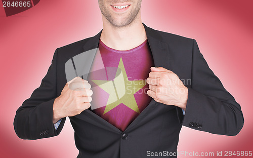 Image of Businessman opening suit to reveal shirt with flag