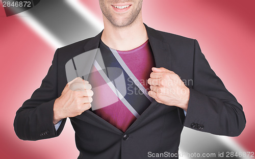 Image of Businessman opening suit to reveal shirt with flag