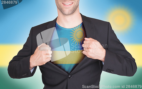 Image of Businessman opening suit to reveal shirt with flag