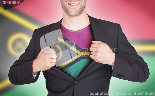 Image of Businessman opening suit to reveal shirt with flag