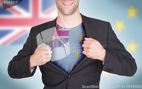 Image of Businessman opening suit to reveal shirt with flag