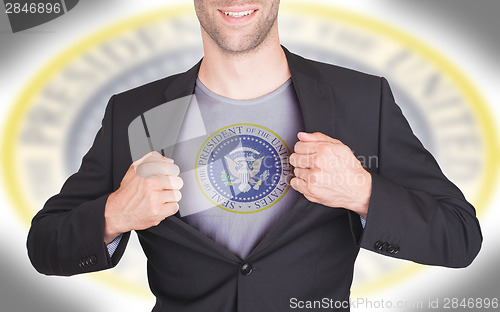 Image of Businessman opening suit to reveal shirt