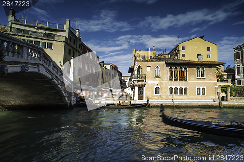 Image of Ancient buildings and boats in the channel in Venice