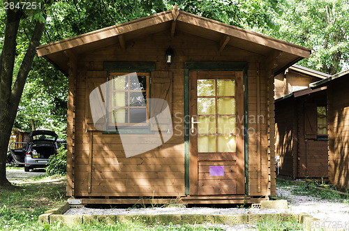 Image of Wooden bungalows on campsite camping