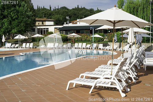 Image of Pool and sun loungers